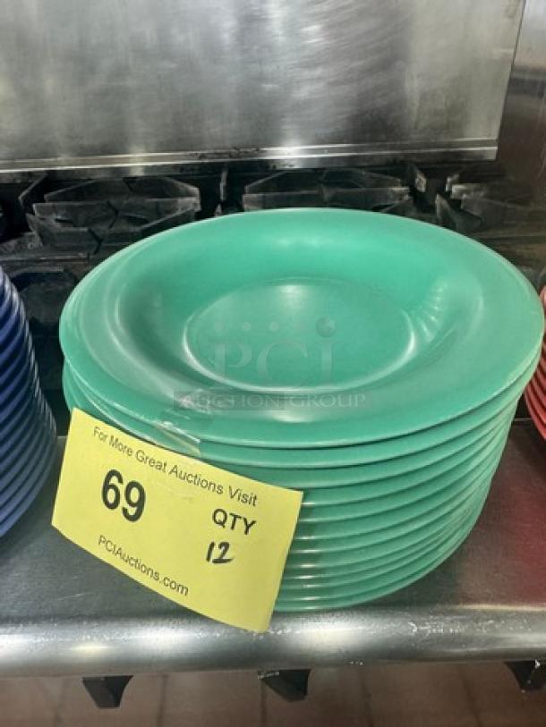 Stack of green melamine plates, model BIDX12, in good condition. Quantity 12 as indicated on label.