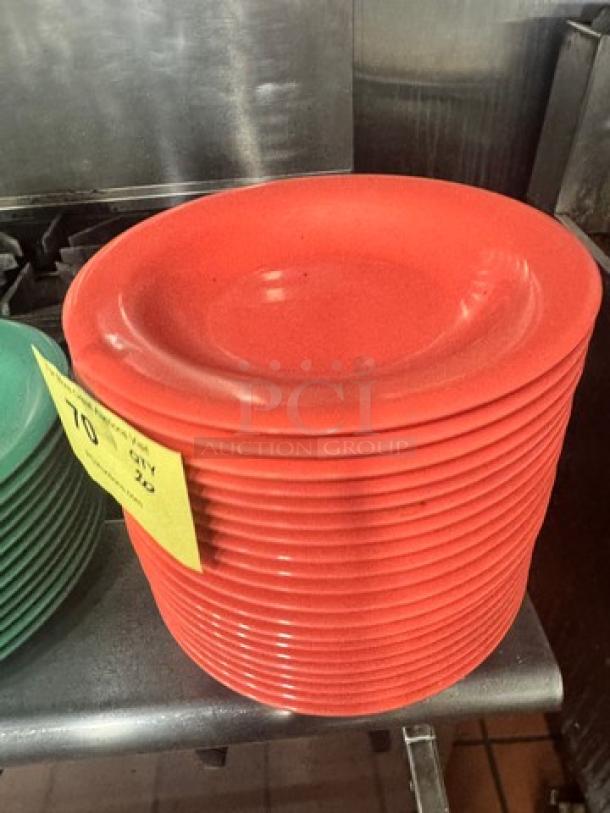 Stack of red Melamine plates, model BIDX20, in good condition with visible price tag indicating quantity 20.