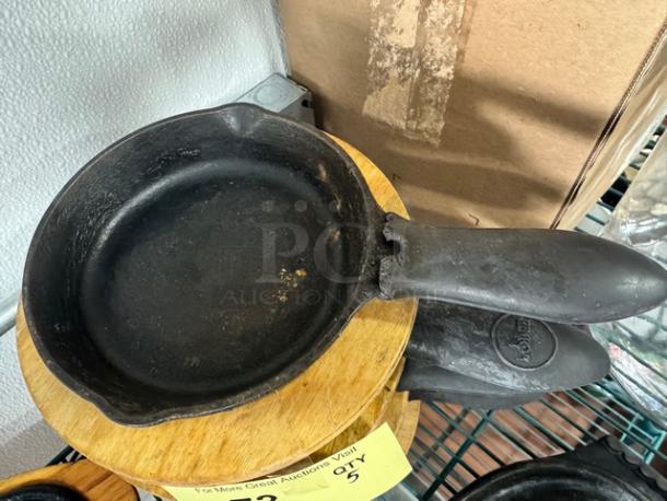 5" cast iron skillet BIDX5, black, used condition, with smooth surface and visible handle. Ideal for collectors or cooking enthusiasts.