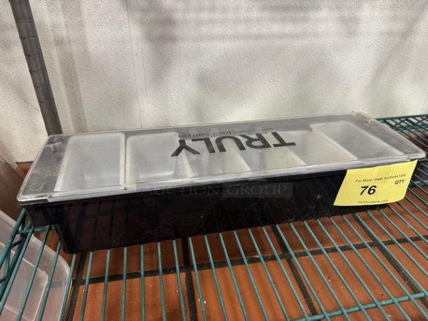 Black True condiment tray with clear lid, five compartments. Label marked "76" for auction. Appears in good condition.