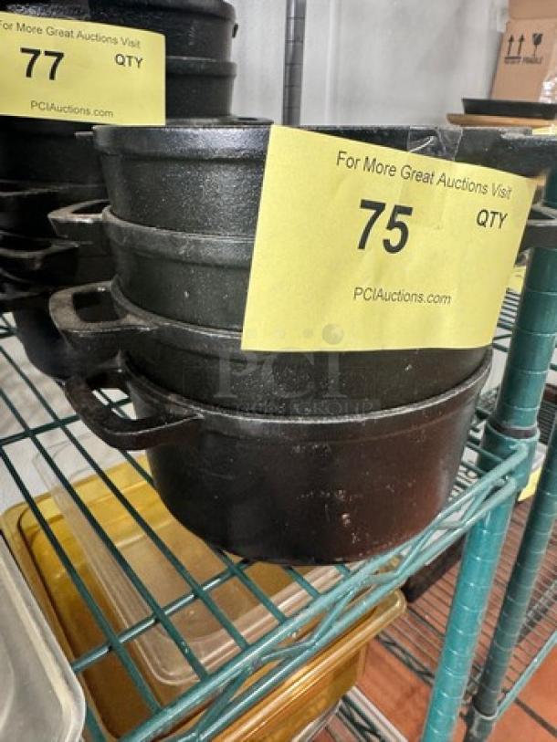 Cast iron small Dutch oven without lid, black, used condition. Item number 75 from PCI Auctions.