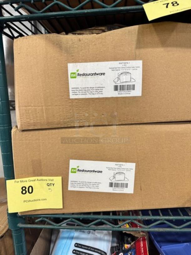 Cardboard boxes containing RW Restaurantware black plastic tabletop condiment caddy-napkin dispenser model BIDX5, new condition.