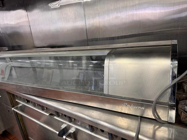 Turbo air SAK-70K Sakura sushi display merchandiser, glass front, stainless steel body, visible Sakura branding, used condition.