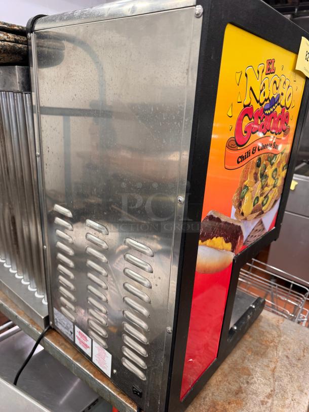 Gold Metal Dual Chili Cheese Dispenser 5301, 120V, "El Nacho Grande" graphics, sturdy condition, visible control panel.