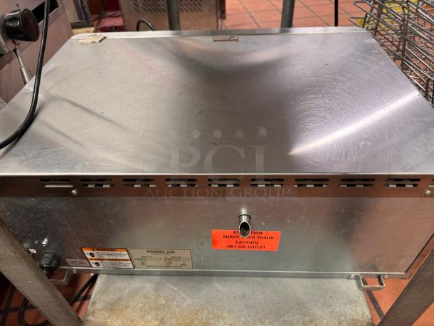 Sodir PZ430S countertop pizza oven, 120V, stainless steel, visible warning label, used condition, model markings on side.
