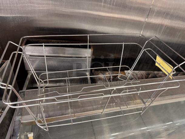 Metal chafing dish stand for full-size tray, model BIDX5, in good condition, with a yellow tag label attached.