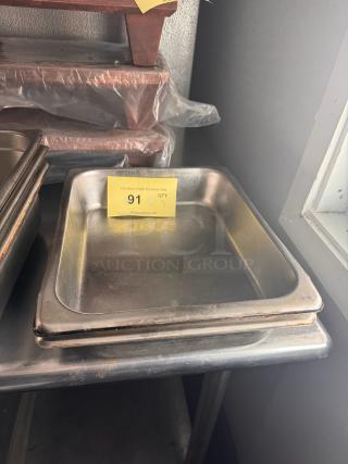 Stainless steel food pan BIDX3, stackable, slightly worn, with auction label 91 indicating quantity of 3.