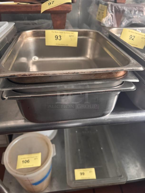 Stainless steel food pan, BIDX3. Slightly used condition with auction label number 93 attached. Stackable design.
