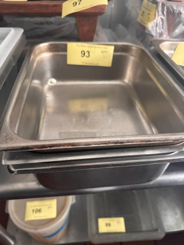 Stainless steel food pan BIDX3, rectangular, gently used, with visible wear on edges, labeled with auction tag #93.