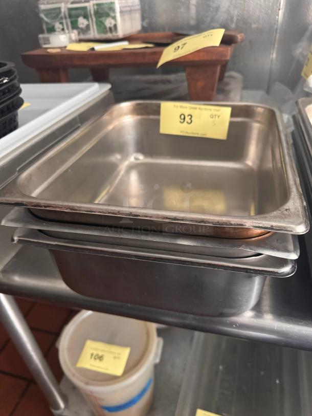 Stainless steel food pan BIDX3, slightly used, rectangular, stackable, with auction tag number 93, quantity 3.