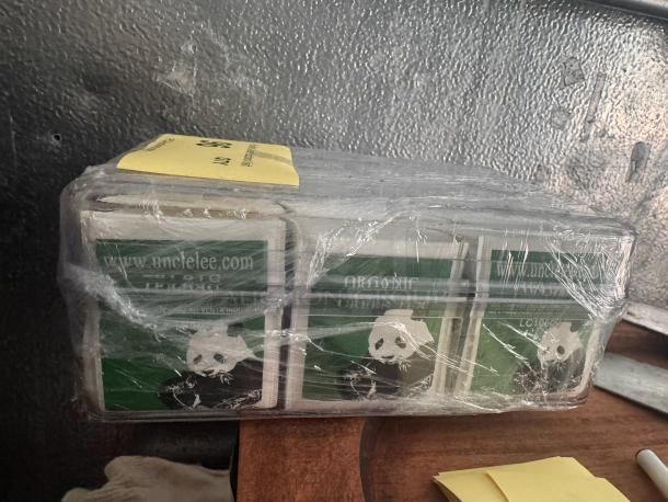 Pack of green tea bags with panda design, wrapped in plastic. Visible label: "umclelee.com." Good condition.