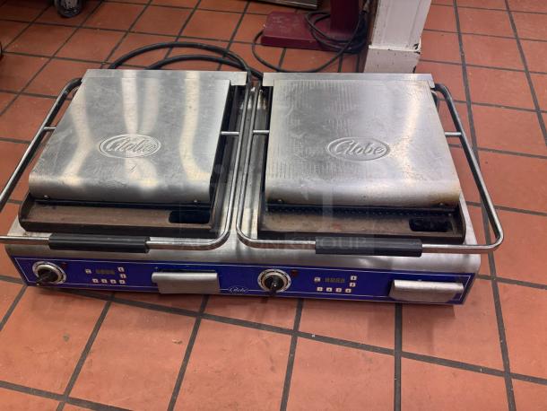 Globe GPGDUE14D double panini grill, 240V, dual brushed steel plates, visible wear, stainless steel finish, logo on each lid.