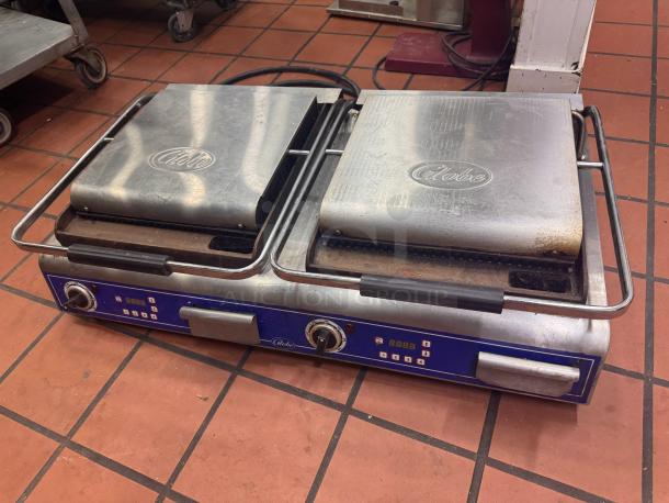 Globe GPGDUE14D Double Panini Grill, 240V, stainless steel, two heated plates, visible wear, branded lid, digital controls.