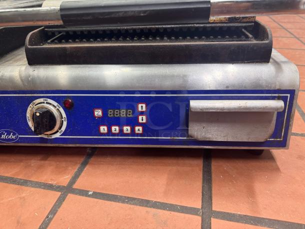 Globe GPGDUE14D Double Panini Grill, 240V, features adjustable controls, used condition, visible wear on dials.