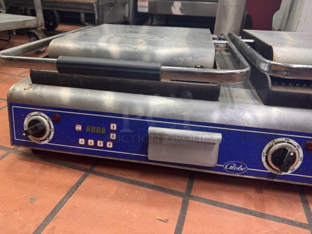 Globe GPGDUE14D Double Panini Grill, 240V. Features dual cooking surfaces, temperature dials, digital display; used condition.