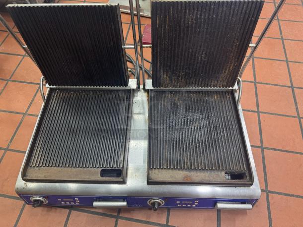 Globe GPGDUE14D Double Panini Grill 240V, ribbed plates, used condition, visible wear on cooking surfaces and controls.