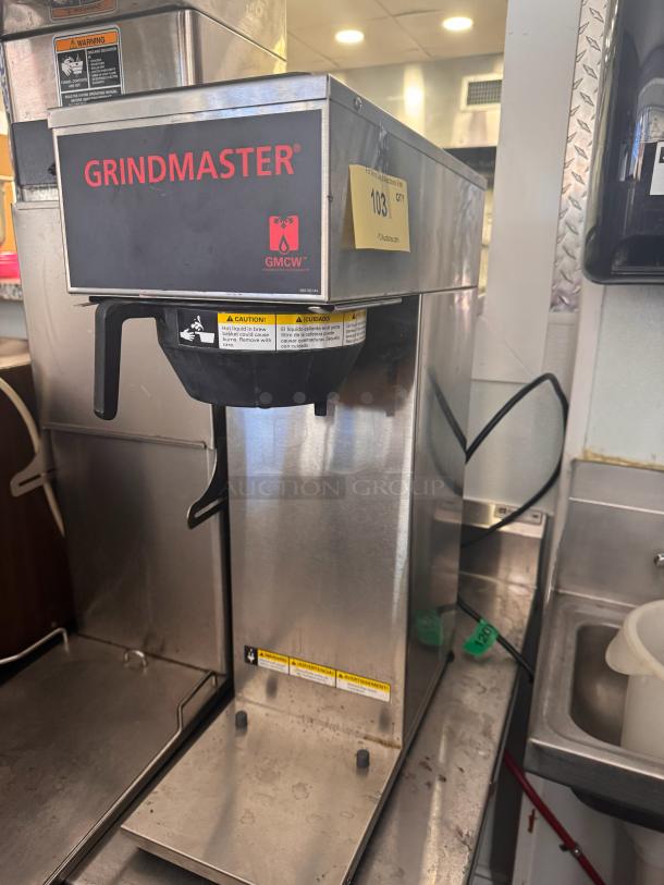 Grindmaster GMCW CPO-SAPP coffee brewer, stainless steel, 120V, used condition, caution labels visible.