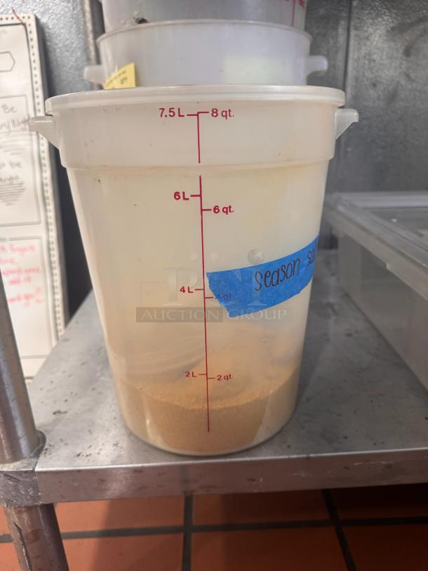 8 quart food storage container with red measurement markings, blue label reading "season-sugar."