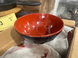 Brand new BIDX12 bowl, red interior, black exterior, pristine condition, displayed in packaging.