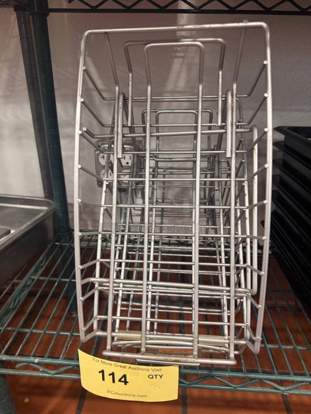 Metal counter display BIDX3 for auction, features sturdy wire construction, good condition, lot number 114 visible.