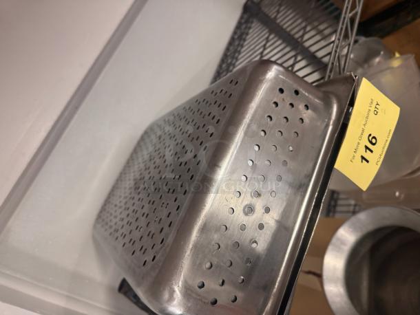 Perforated stainless steel food pan, rectangular shape, visible auction tag numbered 116, in good condition.