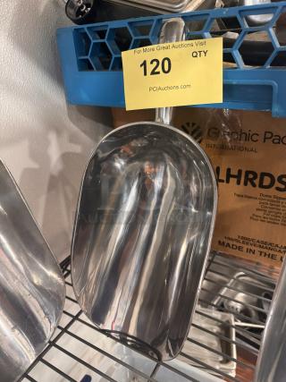 Stainless steel ice scoop with reflective finish, slightly worn. Auction tag showing item number 120.