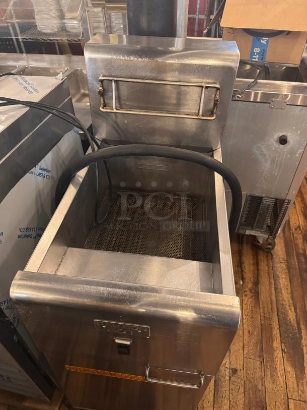 Frymaster SR14ESD electric fryer, 208V, stainless steel, features wire basket, minor wear, nameplate visible.