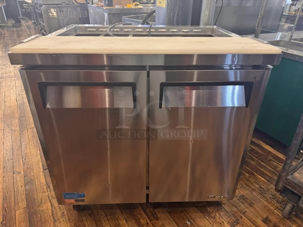Turbo Air MST-36 prep-table, stainless steel, dual-door, on casters, visible brand logo, 115V, excellent condition.
