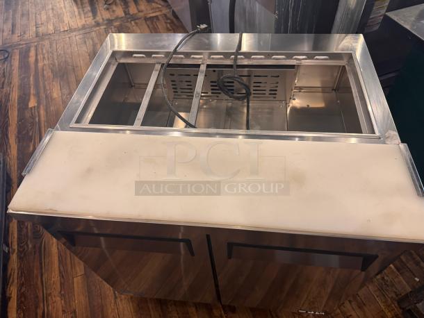 Turbo Air MST-36 prep table, stainless steel, with open compartments and cutting board. Good condition, 115V.