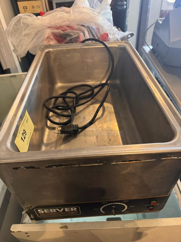 Server FS-20SS countertop food warmer with temperature dial, power switch, visible wear. Model label "Server." Power cord included.