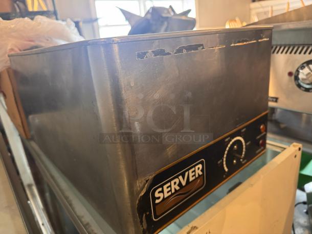 Server FS-20SS countertop food warmer with dial control, visible wear on edges, stainless steel build, ideal for food service.