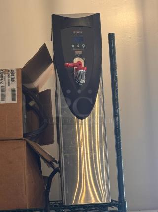 BUNN hot water dispenser, stainless steel with black panel, red tap lever. Digital display, energy saver mode visible. Good condition.