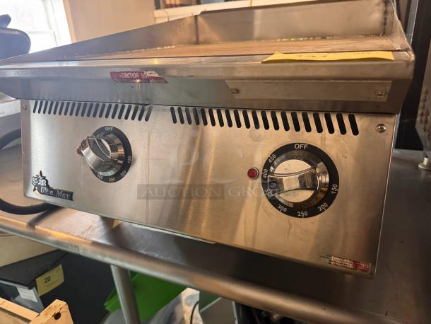 Star Ultra-Max 24" electric griddle; stainless steel, temperature dials, caution label. Ideal for commercial kitchens.