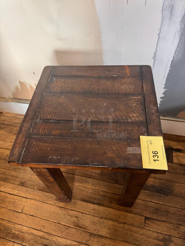 Vintage wooden side table with visible wear and rustic finish, auction lot tag 136 attached.