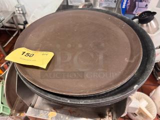 Lot of 4 round trays, lightly worn, stackable. Auction tag reads "150 QTY" from PCIAuctions.com.