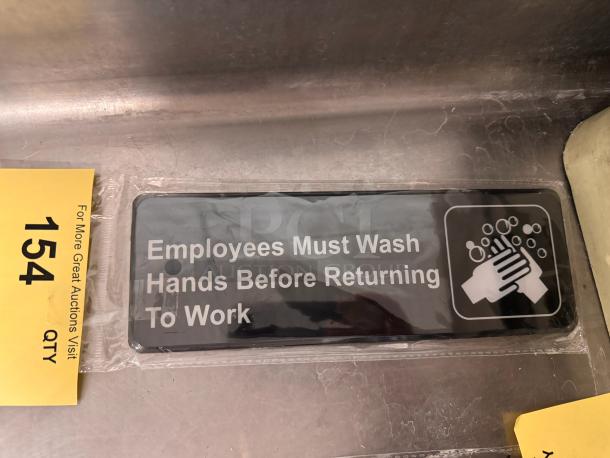 Black and white sign reading "Employees Must Wash Hands Before Returning To Work" with handwashing symbol, brand new condition.