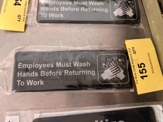 "Employees Must Wash Hands Before Returning to Work" sign, brand new, black background, white text and icon, in packaging.
