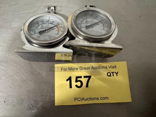 Dual refrigerator/freezer dial thermometers, HACCP guidelines, metal casing, used condition. Lot 157, PCI Auctions.