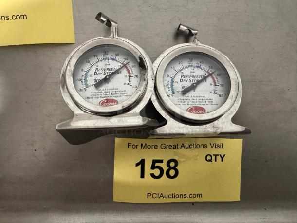 Pair of Cooper thermometers for ref/freezer dry storage, silver with clear dial display, showing temperature range from -20°F to 80°F.