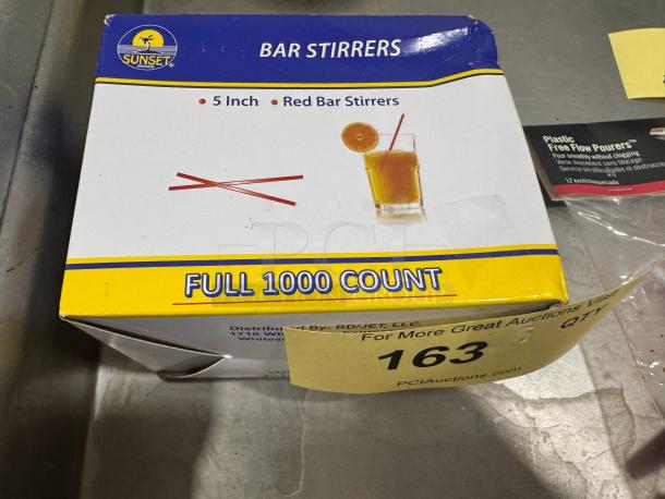 Box of Sunset 5-inch red bar stirrers, full count of 1000, new condition, featuring a drink image and logo on packaging.