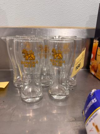 Lot of 8 Singha Beer glasses, clear glass with gold logo, good condition, ideal for collectors and enthusiasts.