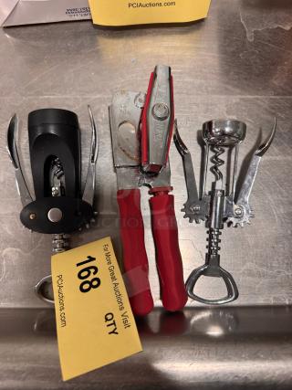 Assorted kitchen tools with red-handled can opener, corkscrew, and wing corkscrew. Used condition. Auction lot 168 tag.