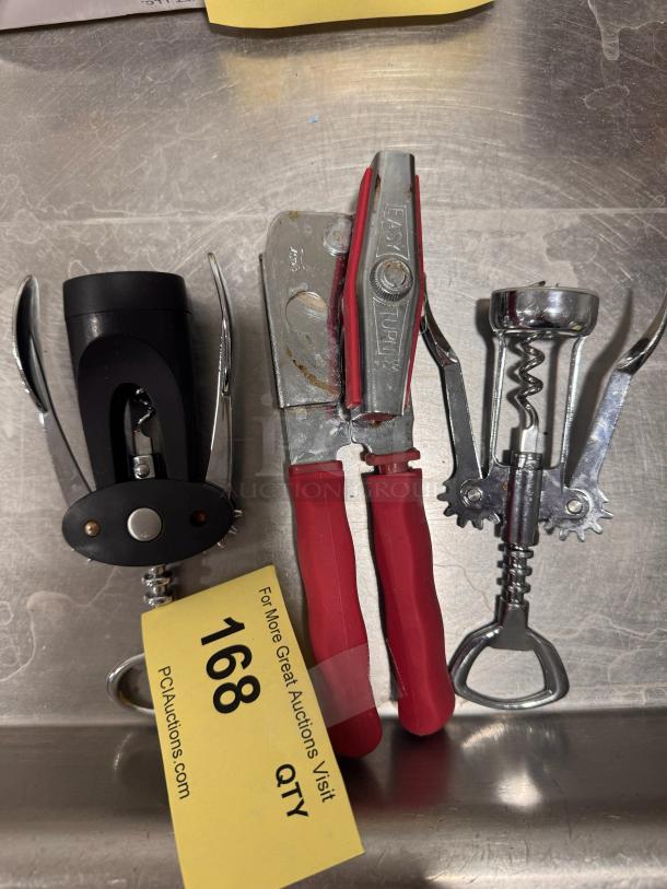 Set of kitchen tools including two corkscrews and a can opener with red handles. Includes auction tag marked "168."