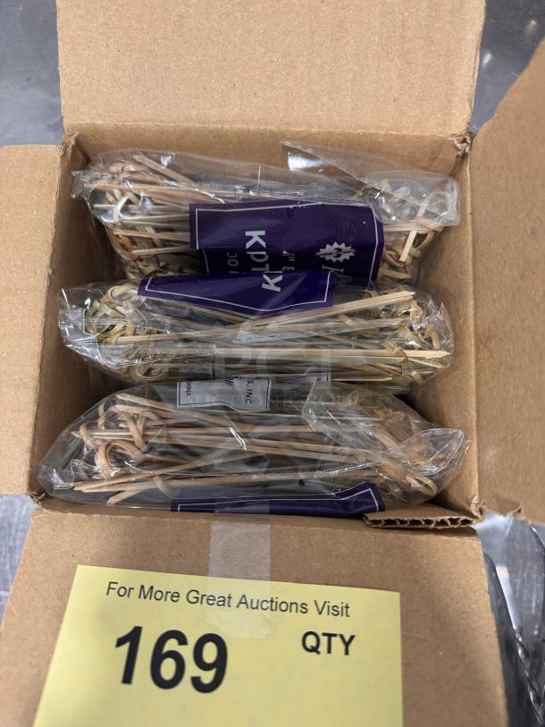 Pack of 4.5" bamboo knot picks in original packaging. Item BIDX3. Box includes quantity tag labeled "169 QTY."