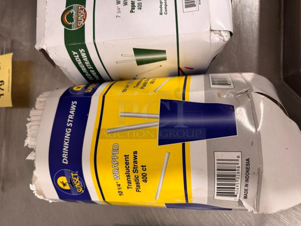 Packages of Sunset straws; 400 ct. each. One box eco-friendly paper straws, another 10.25" wrapped plastic straws; worn packaging.