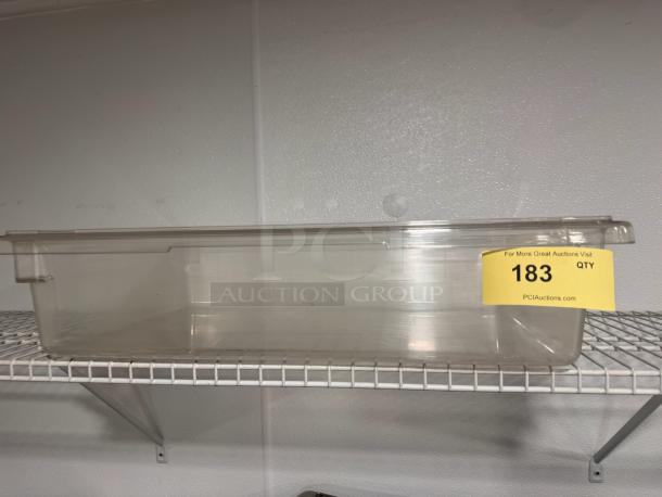 Cambro plastic food storage container, 18x26x6 in, clear, good condition, yellow auction label with number 183 visible.