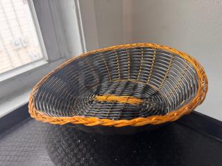 Woven food basket BIDX19, black and brown, oval shape, good condition, intricate design, and durable material.