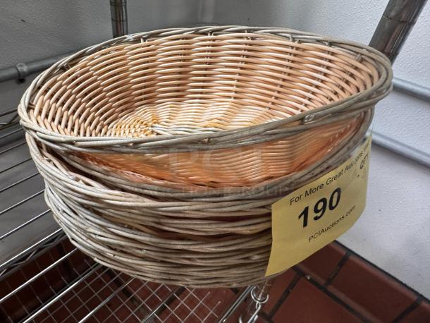 Woven wicker food basket in good condition, with a yellow auction tag labeled "190."