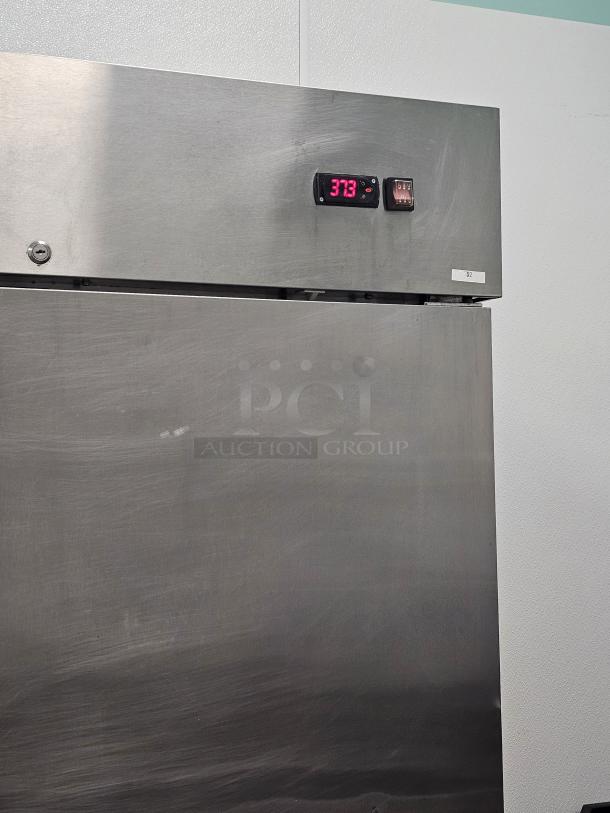 AVATCO 2 solid door refrigerator, model 178A49RHC, stainless steel, tested and working, digital temperature display at 37.3°F.