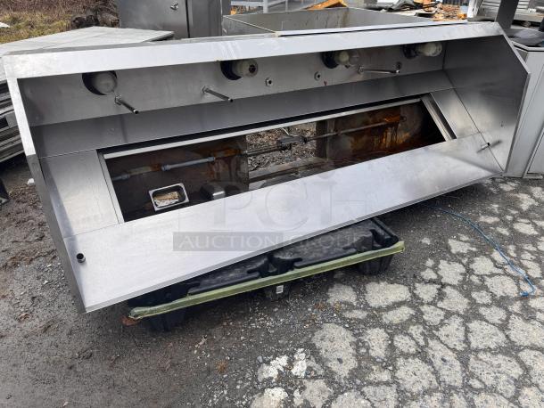 8Ft low profile exhaust hood, stainless steel, with integrated lighting and grease filters. Shows signs of wear.